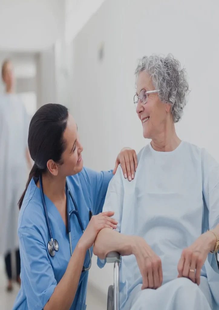 Nurse engages with an elderly woman in a wheelchair, emphasizing the importance of communication in geriatric care