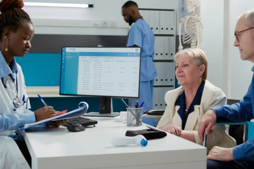 Doctor and two nurses engage with a patient about ensuring accuracy in medical billing practices